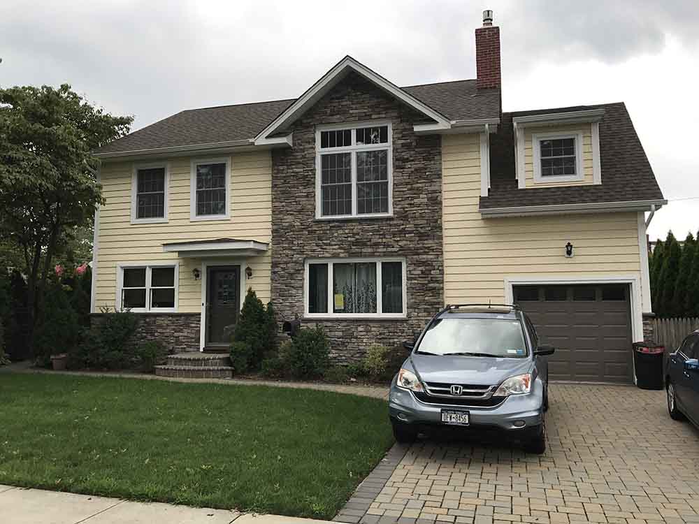 Raised ridge dormer addition in Garden City NY