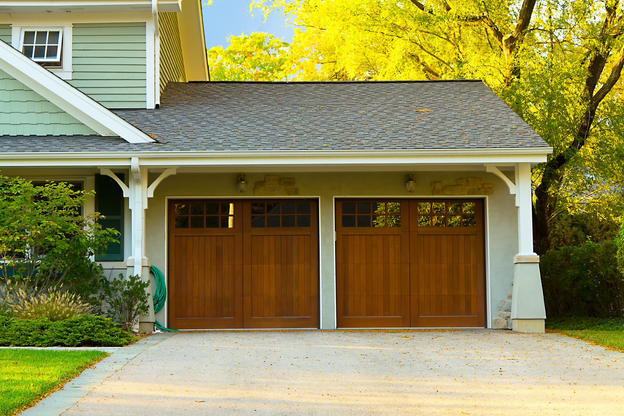 Two card garage with wood doors